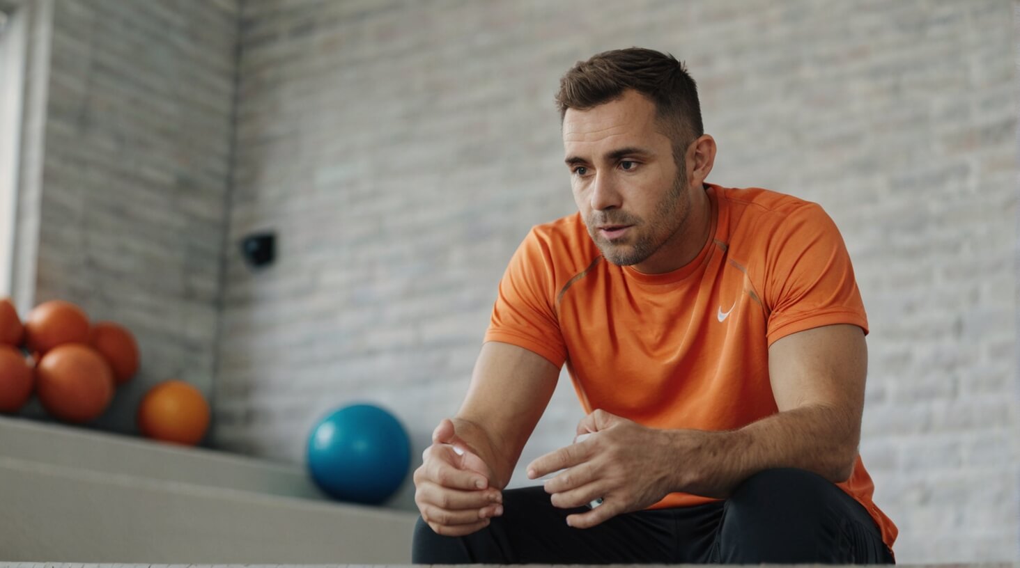 A person stretching during exercise, symbolizing recovery and prevention