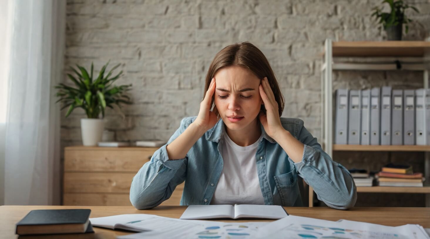 A person juggling multiple tasks with a determined expression, representing the concept of short-term stress benefits.